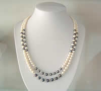 Long black and white pearl necklace