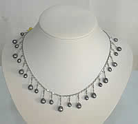 Dropping pearl necklace on stainless steel chain